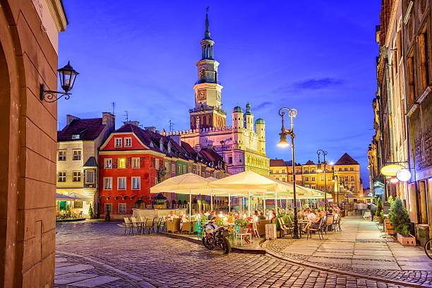 Poznan, Poland Cafes on the main square of the old town of Poznan, Poland on a summer day evening. poznan stock pictures, royalty-free photos & images
