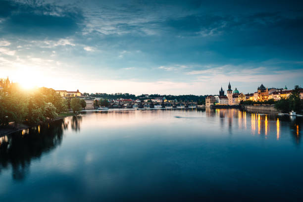 Prague At Sunset Vltava river and Charles Bridge at sunset (Prague, Czech Republic). vltava river stock pictures, royalty-free photos & images