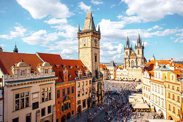Prague cityscape view Cityscape view on the clock tower and Tyn cathedral on the old square in Prague. prague stock pictures, royalty-free photos & images