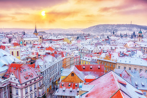Prague, classical view of snowy roofs, city center. Winter scene. Prague down town center at winter Christmas time, classical view on snowy roofs in central part of city. prague stock pictures, royalty-free photos & images