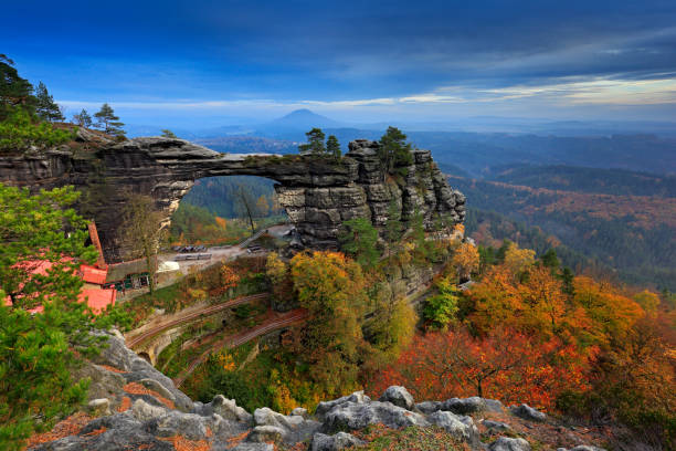 Pravcicka brana, rock monument, sandstone gate. Biggest natural bridge in Europe. Bohemian Switzerland, Hrensko, Czech Republic. Rocky landscape, autumn. Beautiful nature with stone, forest and fog. Pravcicka brana, rock monument, sandstone gate. Biggest natural bridge in Europe. Bohemian Switzerland, Hrensko, Czech Republic. Rocky landscape, autumn. Beautiful nature with stone, forest and fog. czech republic stock pictures, royalty-free photos & images