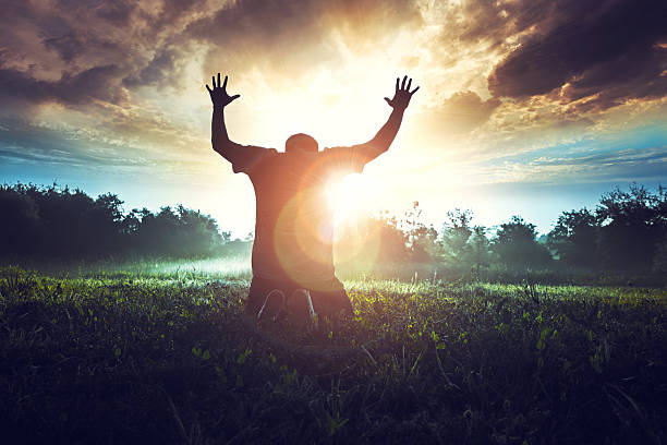 Prayer in the morning in a beautiful sunrise stock photo