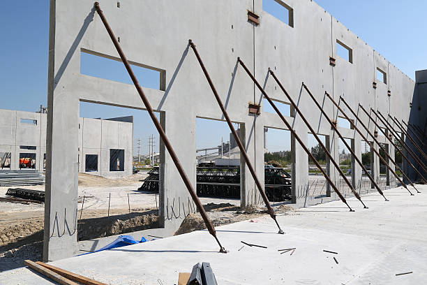 Prefab Walls Construction Site Prefab Walls With door ways on a Construction Site prefabricated building stock pictures, royalty-free photos & images