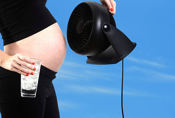 pregnancy hormones and hot flash stock photo