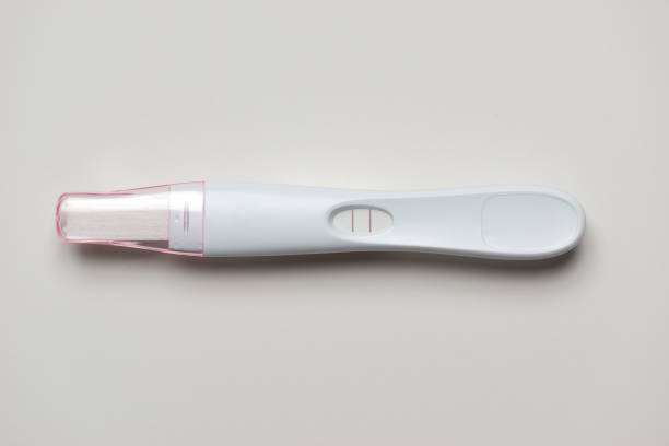 Pregnancy test Used pregnancy test showing result on the white background positive pregnancy test stock pictures, royalty-free photos & images