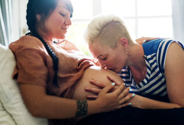 A pregnant lesbian woman A pregnant lesbian woman gay person stock pictures, royalty-free photos & images