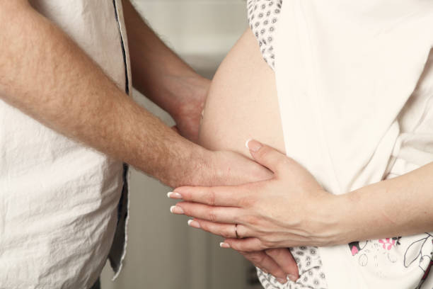 Pregnant mother and happy father. stock photo