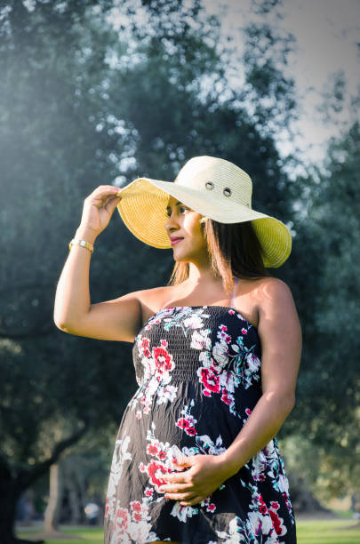 Pregnant Peruvian woman in a forest, beautiful young Peruvian girl waiting for a child Pregnant Peruvian woman in a forest, beautiful young Peruvian girl waiting for a child, a naughty woman with dark hair in dress with hat on nature hot peruvian women stock pictures, royalty-free photos & images