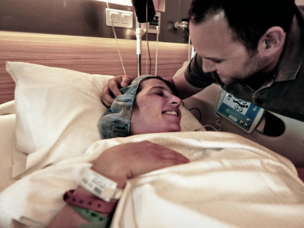 Pregnant woman and her husbant at hospital stock photo