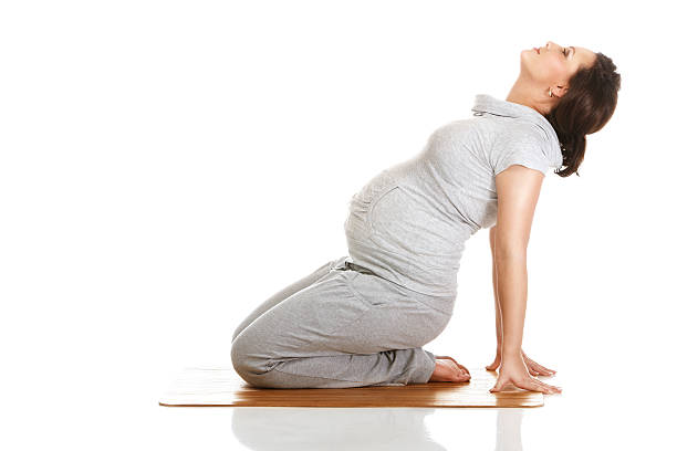 Pregnant woman practising aerobics stock photo