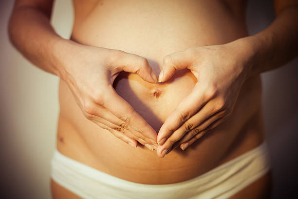 Pregnant woman with concept of love stock photo