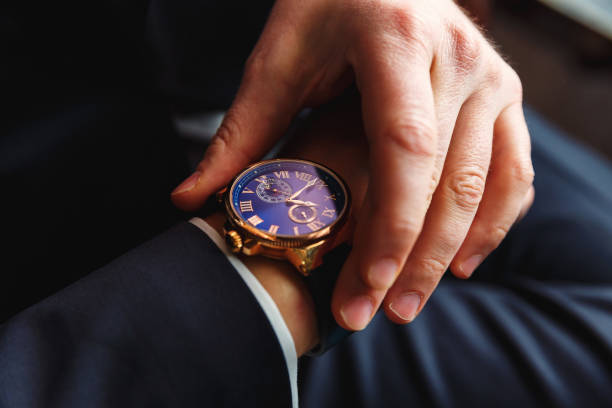 Premium men's watch on hand close up Watches wrist watch stock pictures, royalty-free photos & images