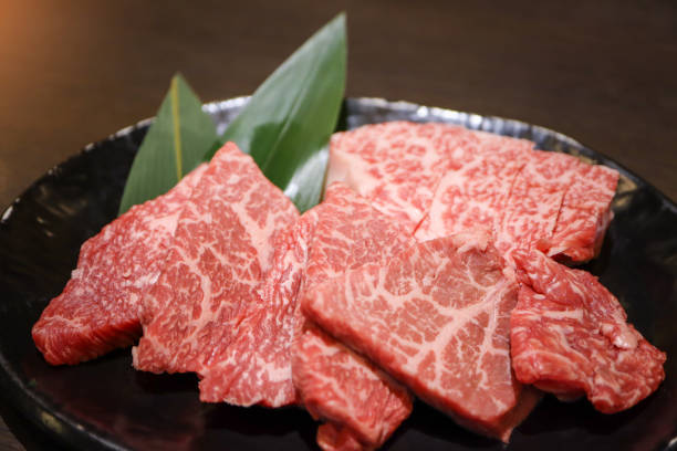 Premium quality raw sliced Wagyu beef A5 steak in the black plate for Yakiniku. Japanese foods style. stock photo