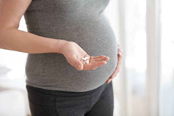Prenatal vitamins are important for proper development stock photo