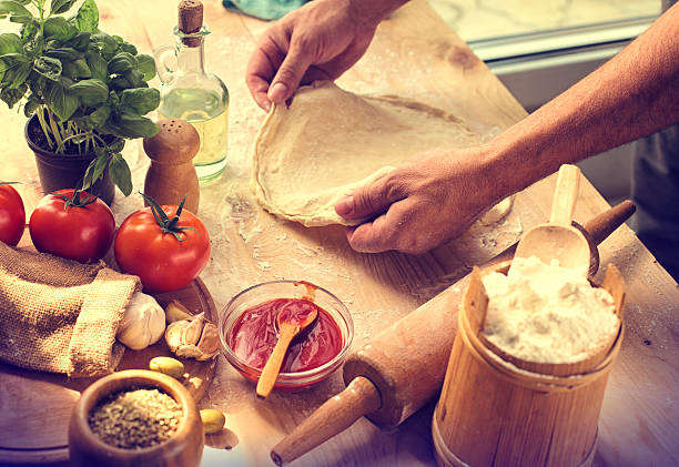 Preparing ingredients of homemade pizza Preparing ingredients of homemade pizza artisanal food and drink stock pictures, royalty-free photos & images