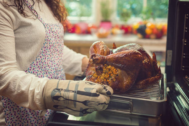 Preparing Turkey for Thanksgiving Dinner stock photo