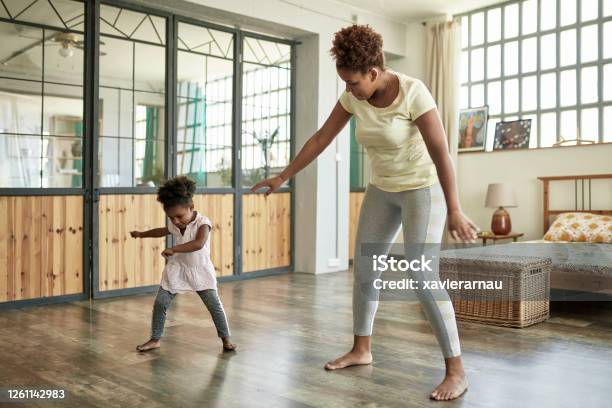 Preschool Age Girl Enjoying Dance Exercises With Mother