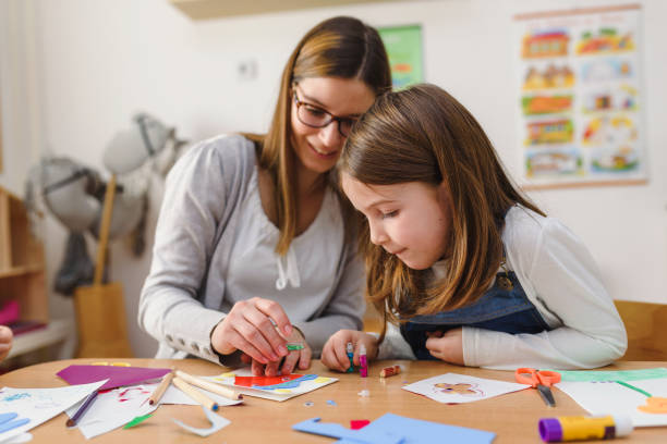 Preschool Teacher With Cute Girl - Creative Art Class Beautiful mother and daughter spending time together swedish girl stock pictures, royalty-free photos & images