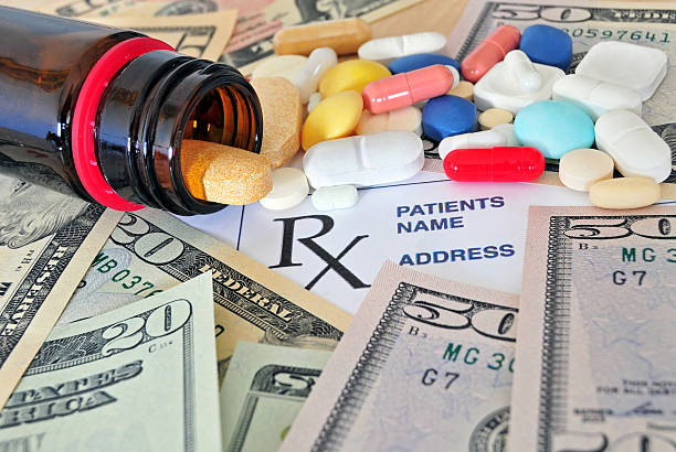 Prescription pills with money stock photo