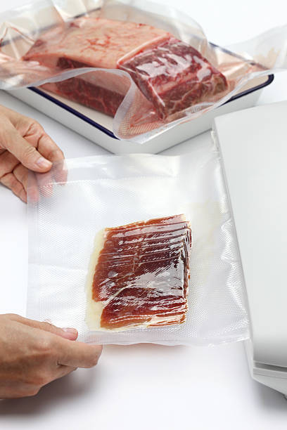 preserving fresh meat and raw ham in a vacuum sealer preserving fresh meat and raw ham in a vacuum sealer airtight stock pictures, royalty-free photos & images