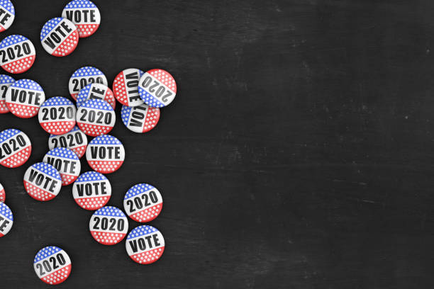 2020 US President Election Political Pin Background Copy Space Large group of 2020 US presidential election pins on rustic black wood background with copy space. election stock pictures, royalty-free photos & images