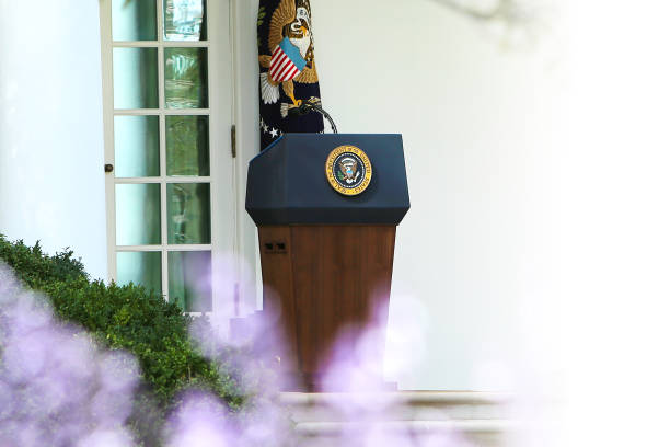 President's Podium President of the United States Podium, flowers in front copyspace presidential election stock pictures, royalty-free photos & images