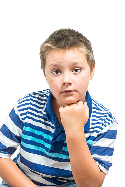 Preteen Boy Making Facial Expressions stock photo