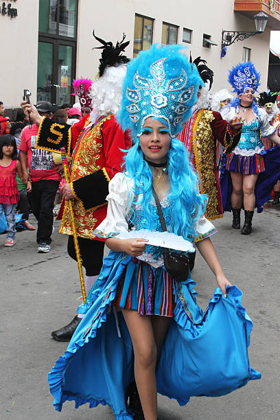 Pretty Blue-Haired Young Woman Marching in Parade, Peru stock photo