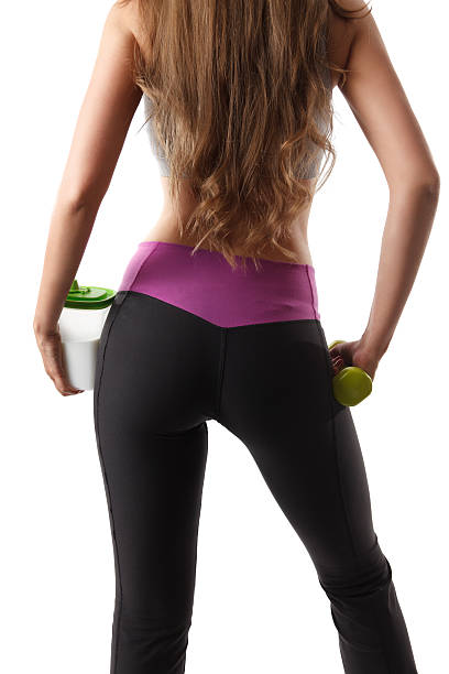 Pretty fitness woman's back and buttocks stock photo