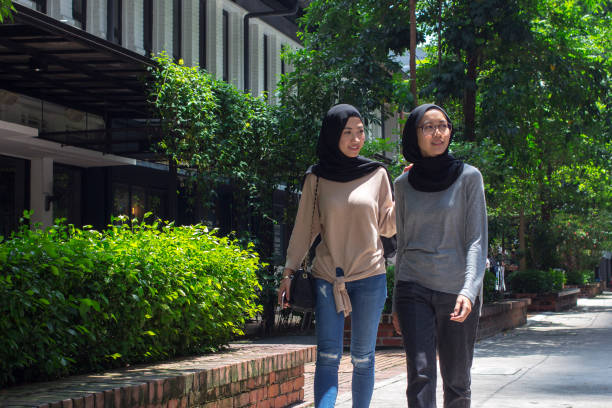 Pretty Happy Muslim Girls Walking On The Street Stylish Relaxed
