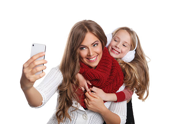 Pretty woman and child taking a selfie stock photo