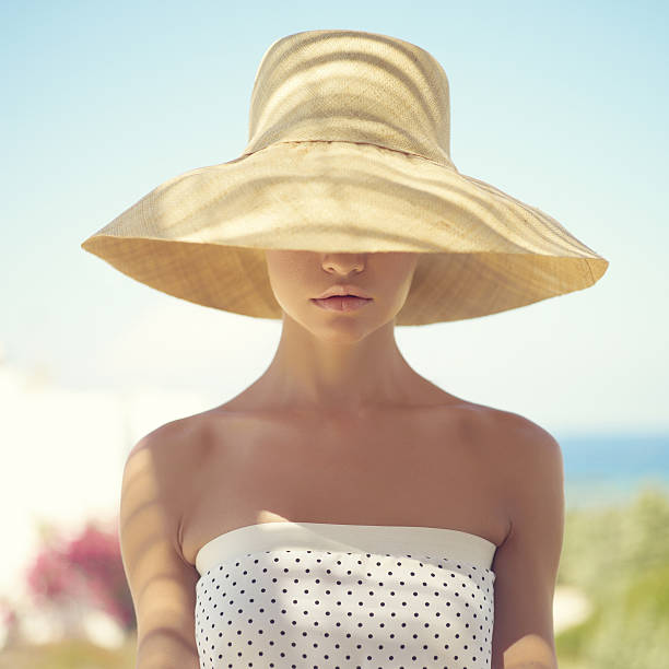 Pretty woman in straw hat stock photo
