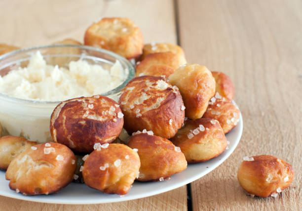 Pretzels Bites Homemade Salty Pretzels Bites with Cheddar Dip chewing stock pictures, royalty-free photos & images