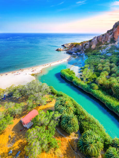 Preveli beach at Libyan sea, river and palm forest, southern Crete , Greece stock photo