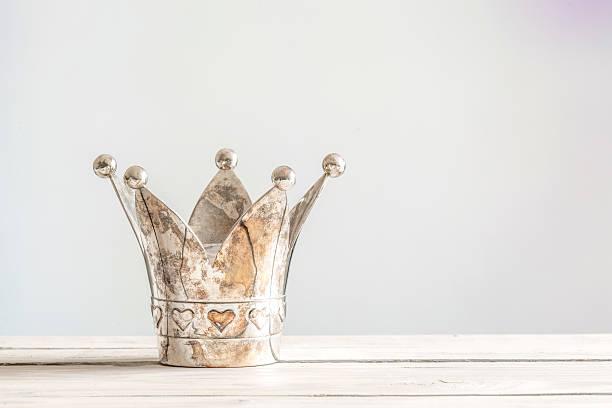 Princess crown on a wooden table stock photo