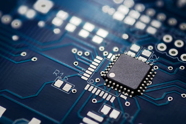 Printed circuit board and chip Electronic chip component on the blue printed circuit board semiconductor stock pictures, royalty-free photos & images