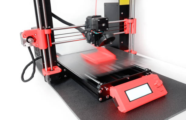 3D printer printing a plastic object with colored filament. New generation of 3D Printing Machine stock photo
