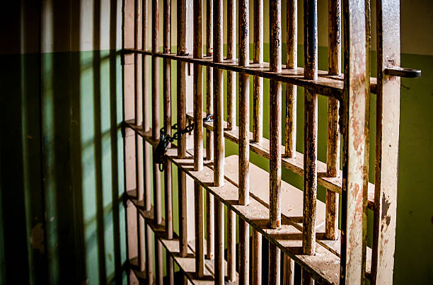 Prison Cell bars stock photo