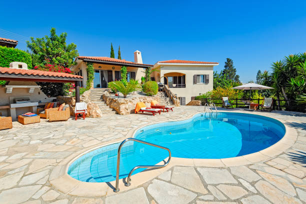 Private swimming pool and patio area Private swimming pool and patio area outside Cyprus villa villa stock pictures, royalty-free photos & images