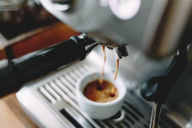 Process of making classic espresso in machine stock photo