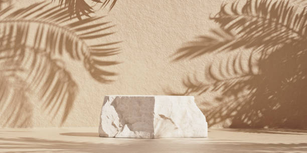 Product rock podium with palm shadows for cosmetic presentation stock photo