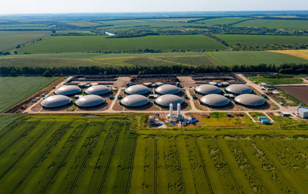 Production of sustainable fuel called bio gas. New factory in field. View from above. Ecological production concept stock photo