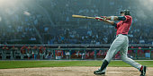istock Professional Baseball Player Hits Ball In Mid Swing During Game 936566536