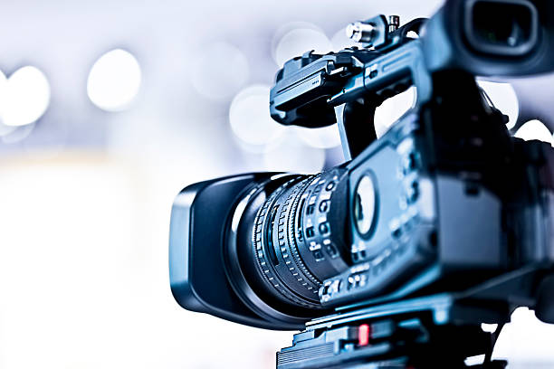 Professional HD video camera in studio Professional HD video camera. Shallow DOF, selective focus.  studio workplace photos stock pictures, royalty-free photos & images