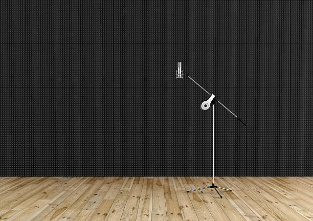 Professional microphone in a recording studio Professional microphone in a recording studio with black acoustic panel and wooden floor - rendering soundproof stock pictures, royalty-free photos & images