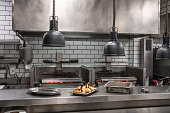 istock Professional restaurant stainless steel kitchen with coal embers grill 1330509419