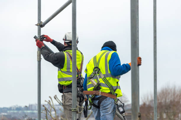 Professional scaffolders working on scaffolding in the UK stock photo