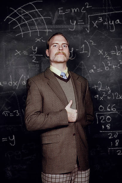 Professor Retro-styled professor, with mathematical equations on chalkboard. physics photos stock pictures, royalty-free photos & images