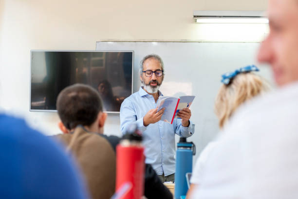 Professor reading to a class stock photo