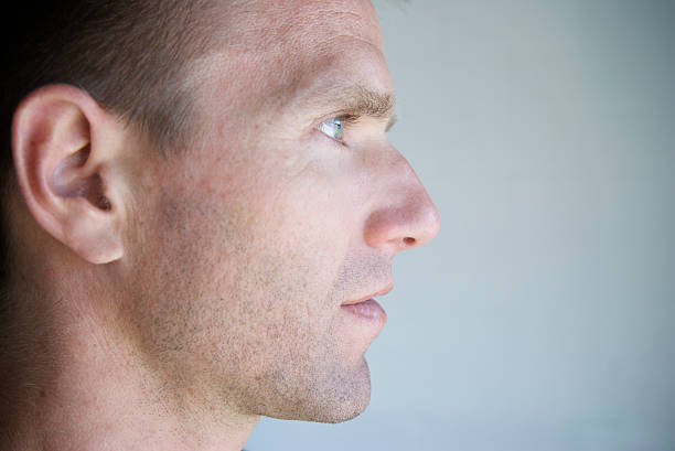 Profile of Young Man Close-Up Blue Eyes stock photo